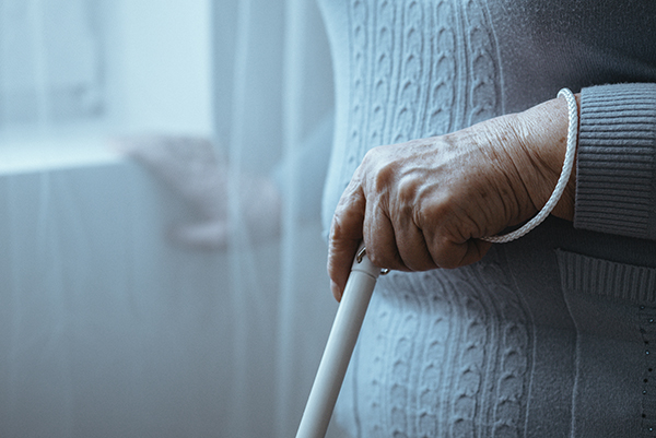 Blind person holding white cane