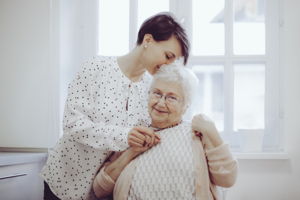 Adult caregiver with senior mother - caring for elderly parents at home - home nursing care orange county