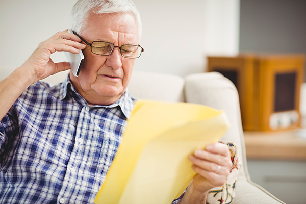 Senior man talking to Senior Phone Scams