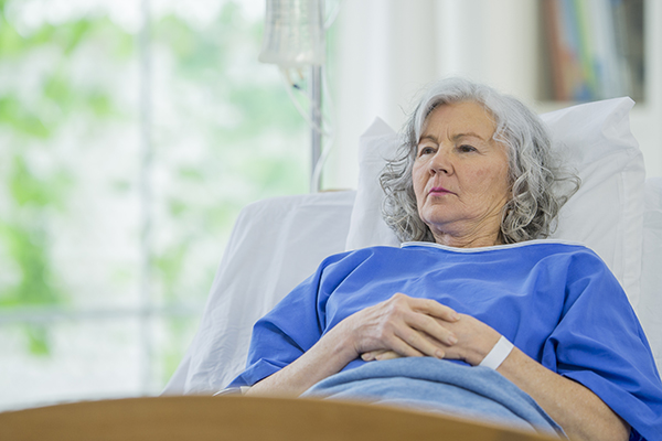 Senior woman in hospital bed