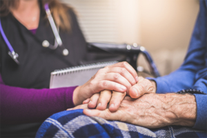 Hospice Nurse visiting an elderly male patient