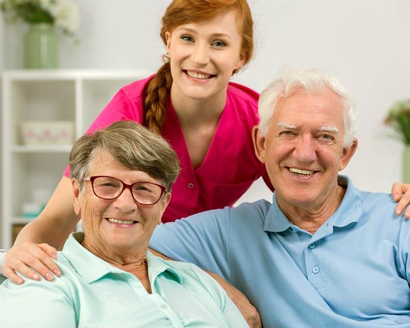 Caregiver with client couple