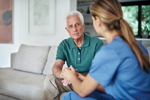 caregiver calming senior man