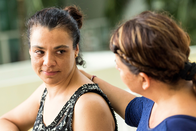 woman being comforted by a friend