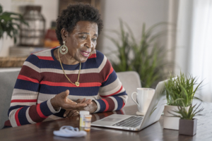 woman speaking with a female medical professional via video chat