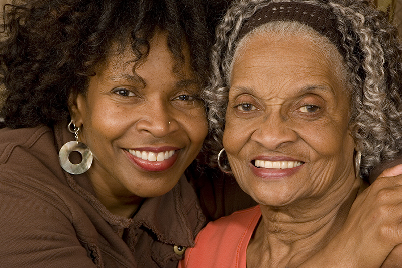 happy adult daughter with Alzheimer's mother