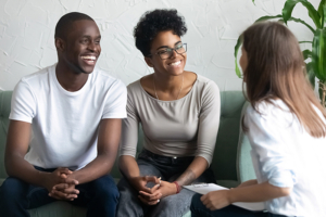 happy siblings talking with mediator