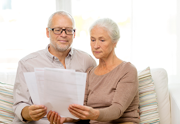 senior couple with papers at home