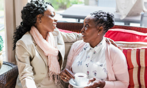 family-caregiver-talking-with-senior-woman
