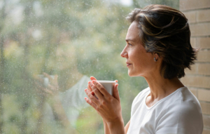 sad lady looking out window