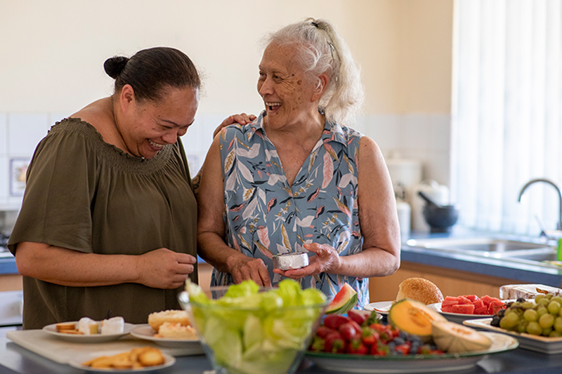 happy ladies preparing food