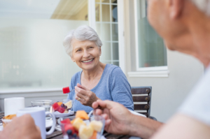 Senior woman having breakfast with her partner