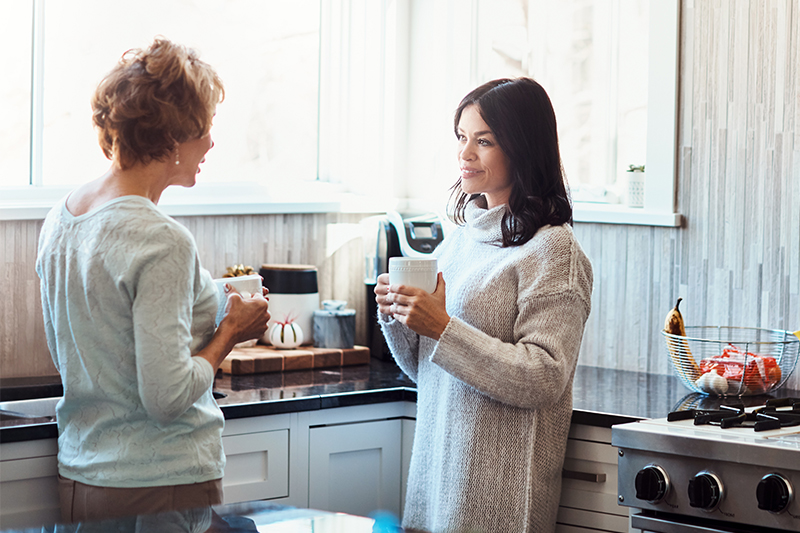 Two female relatives work on building stronger family relationships by having a courageous conversation.