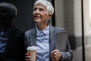 A professional woman on her way to work ponders strategies for balancing work and elderly care.